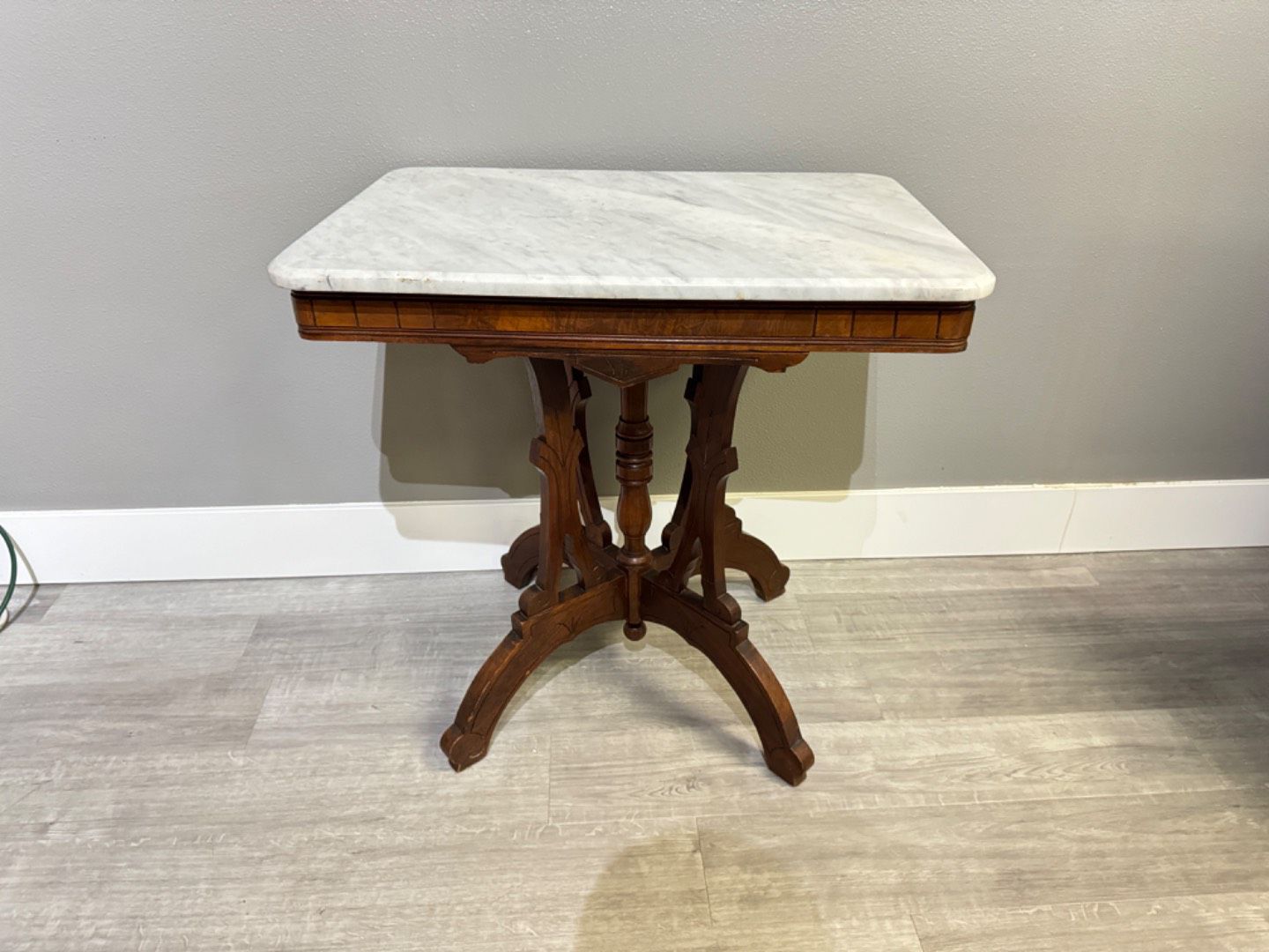 Antique Eastlake Victorian walnut marble top lamp table.