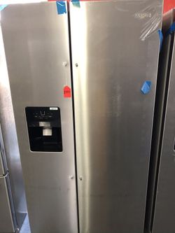 New scratch and dent whirlpool 25 cu ft side by side stainless steel fridge. 1 year warranty