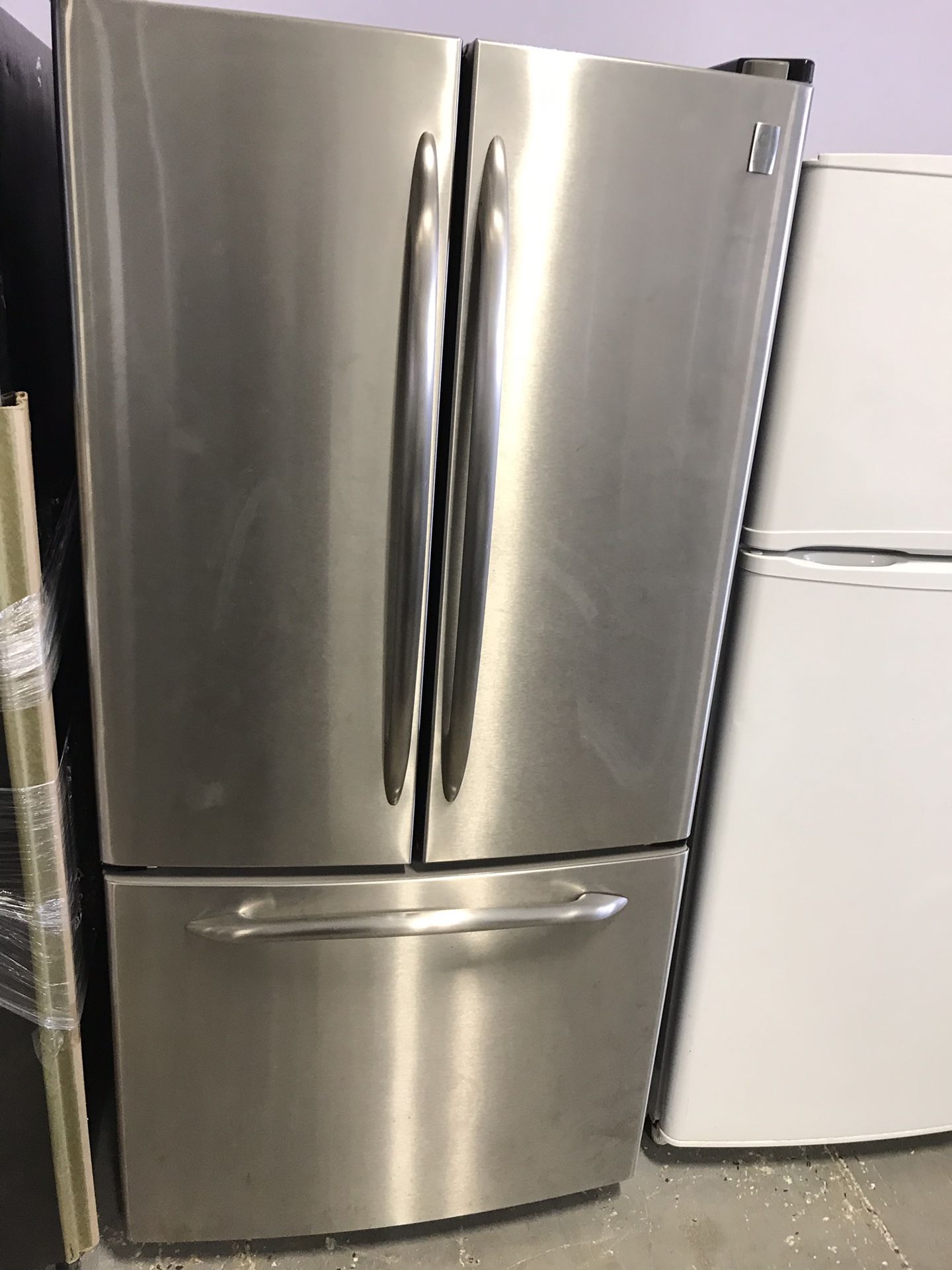 Ge profile refurbished stainless steel 36” French door refrigerator.