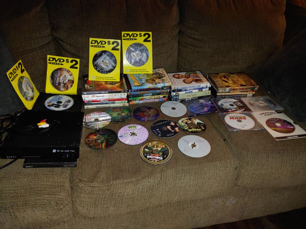 A DVD player Dynex and 40 + DVDs all together
