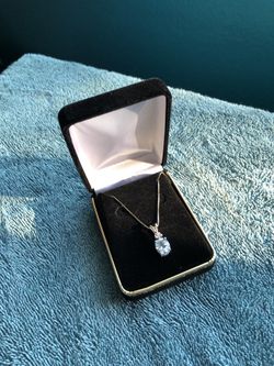 Diamond and topaz sterling silver pendant