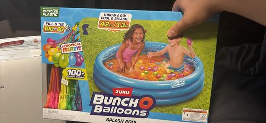 Kids pool with water balloons