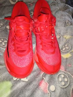 Red basketball shoes giannises I think