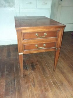 End table with hidden shelf