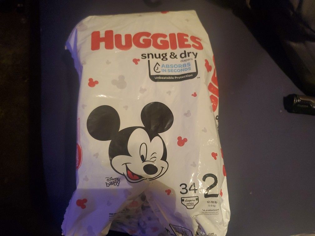 12 Size 2 Huggies Diapers