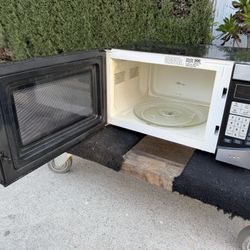Small Microwave In Good Condition  By Oster  19” Wide  13” Side  11” 