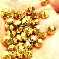 Over 100 Brass Saucer Beads