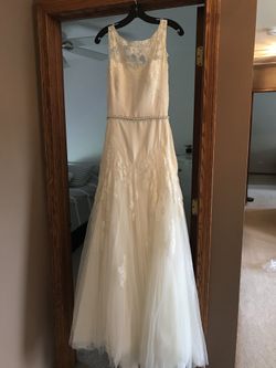 Wedding dress with a mid length beautiful veil