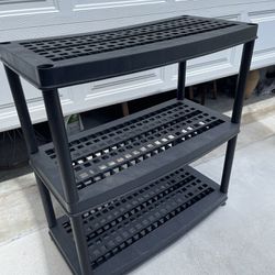 Black Plastic shelf. Please see pictures for measurements.