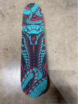 Madd Gear 31-inch "Learn to Ride" complete skateboard featuring a snake graphic deck.