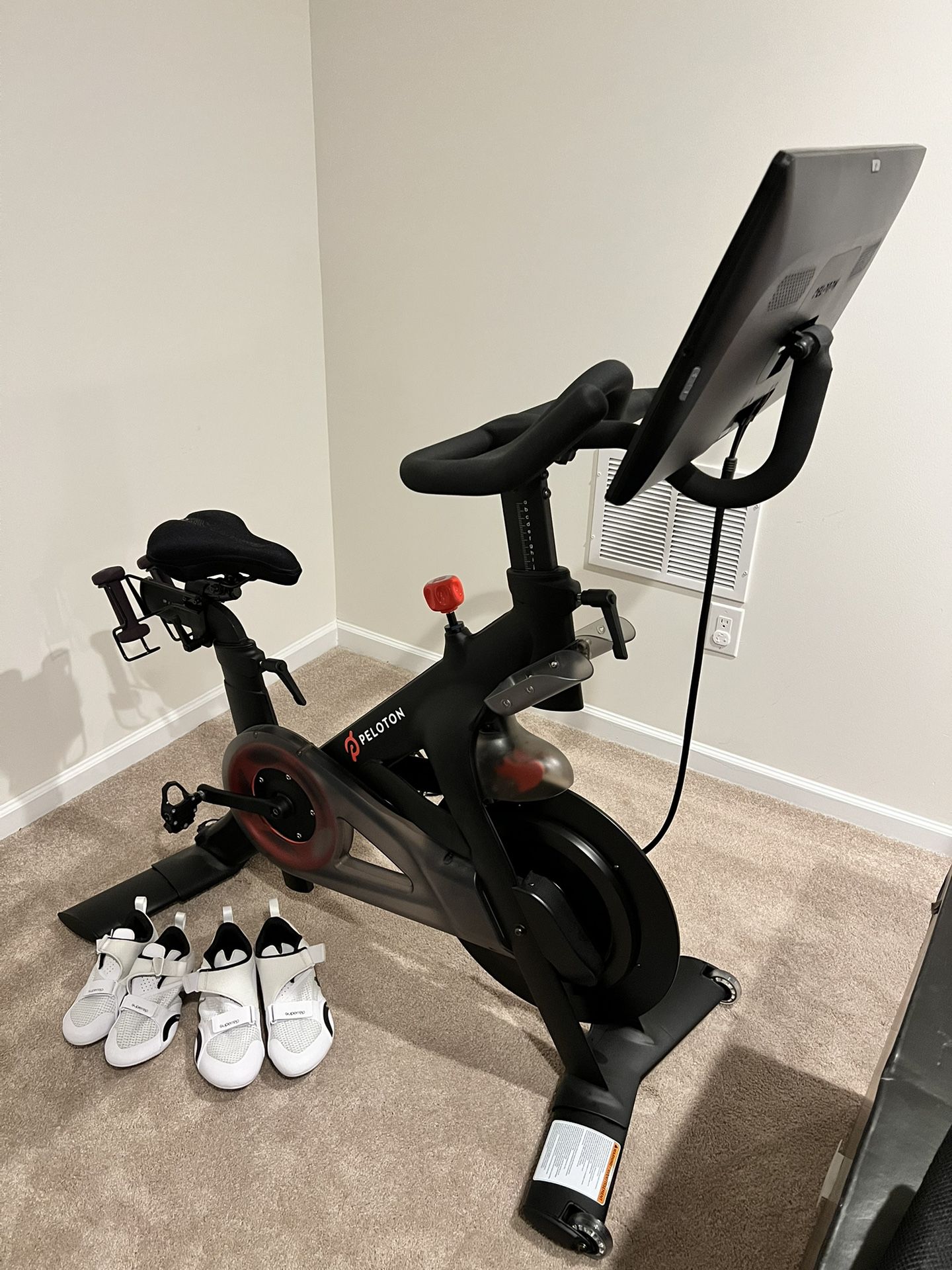 Peloton Bike (Updated Seat Post) Includes 2 pairs of Nike Cycling Shoes (men & women) and a set of 2lb weights 
