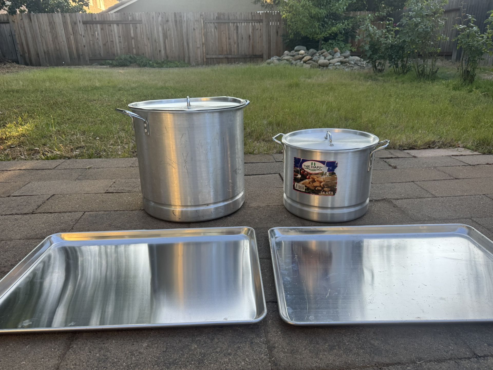 A set of large pots and trays.