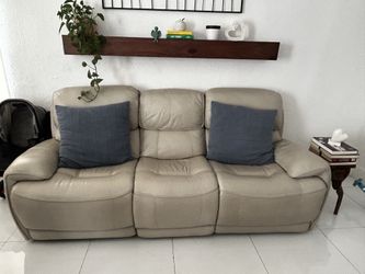 Beautiful beige leather power reclining sofa with USB charging ports