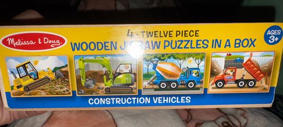 Like new. 4 wooden puzzle pack. All there