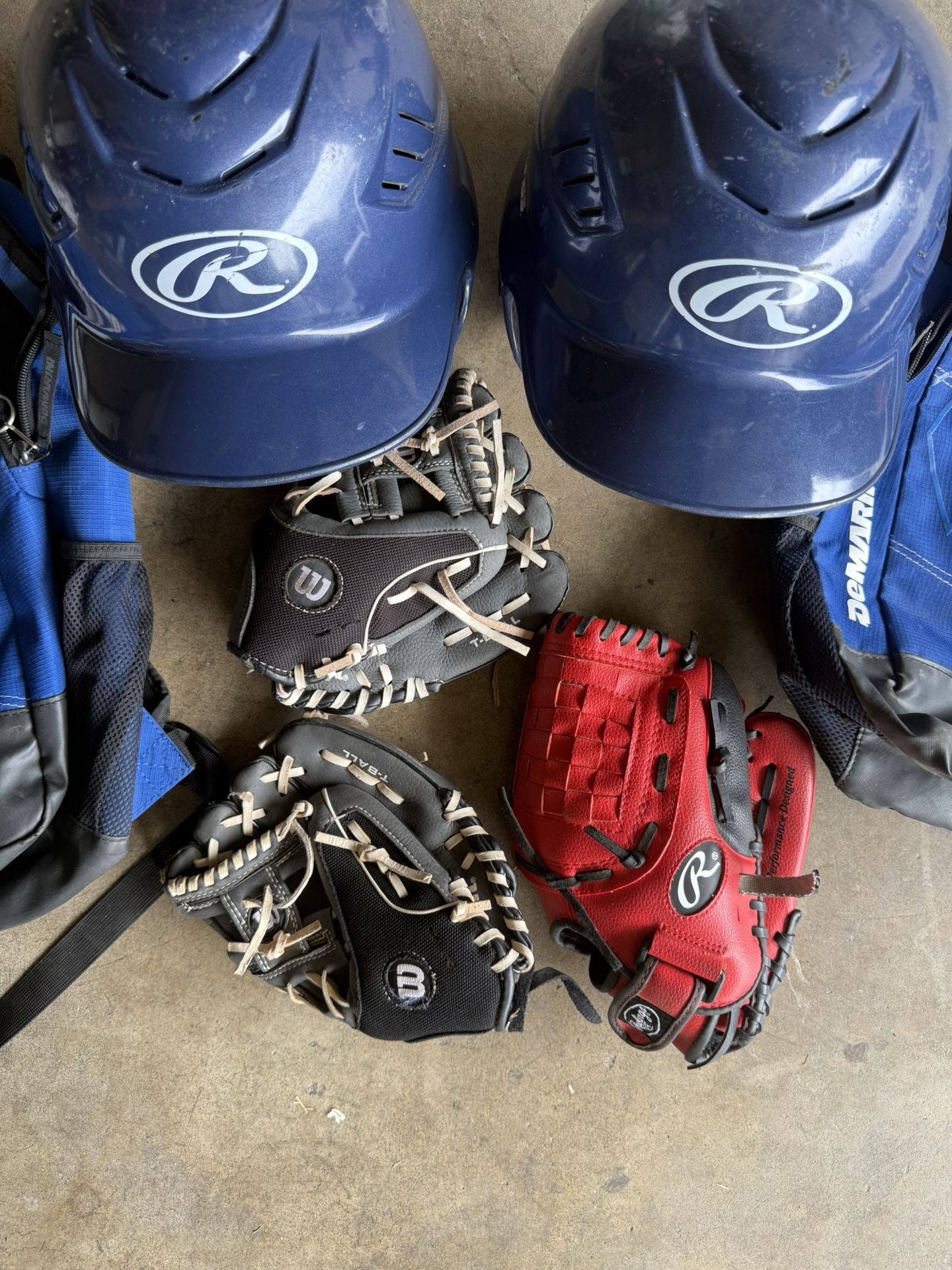 Couple Sets Of Kids Baseball Gear.