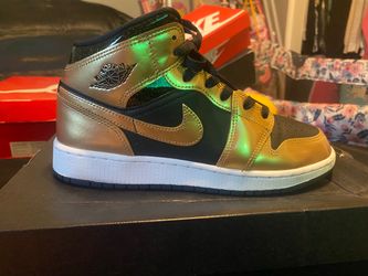 Black and gold Jordan 1s