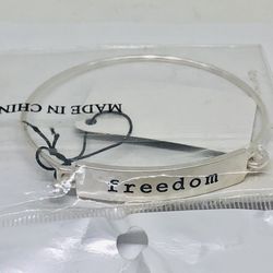 New bracelet in a bag silver tone with freedom sign