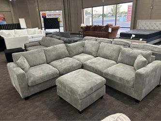 Gray modern sectional and ottoman