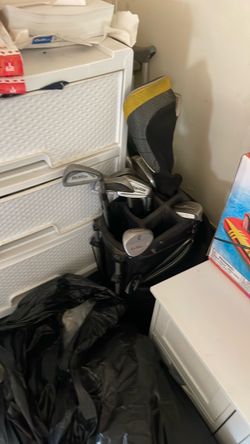 Golf clubs in a black Nike bag
