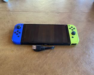 Nintendo switch OLED BLUE AND YELLOW Joycons
