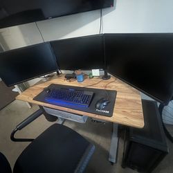 3 computer monitors with desk mount