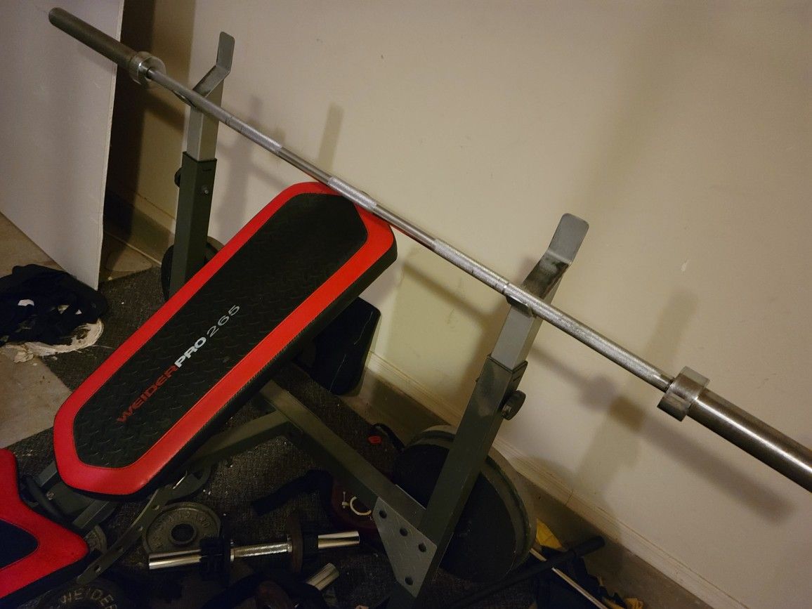 Weider Pro 265 incline Bench with Lat pulldown and Preacher Curl attachment and leg extension. And Olympic bar and four 35lb plates.