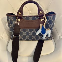 Celine leather macadam denim handbag with straps.
