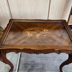 Vintage wooden side table with glass top