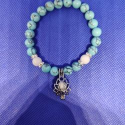 Glow In The Dark Turquoise Bracelet With Lotus Charm