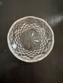 It is a small cut-glass bowl.