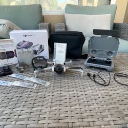 DJI   Mini   4   Pro   Fly   More   Combo   (RC2   Remote)   +   16   ND   Filters   +   Sun   Hood   Flawless