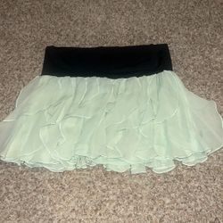 Bebe light green ruffle skirt size M
