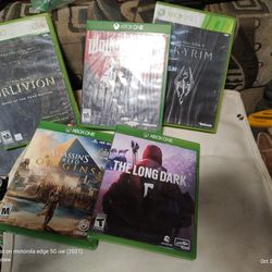 Three Xbox One Games Wolfenstein 2 Assassin's Creed Origins And The Long Dark And Two Xbox 360 Games The Elder Scrolls For Oblivion And The Elder Scro