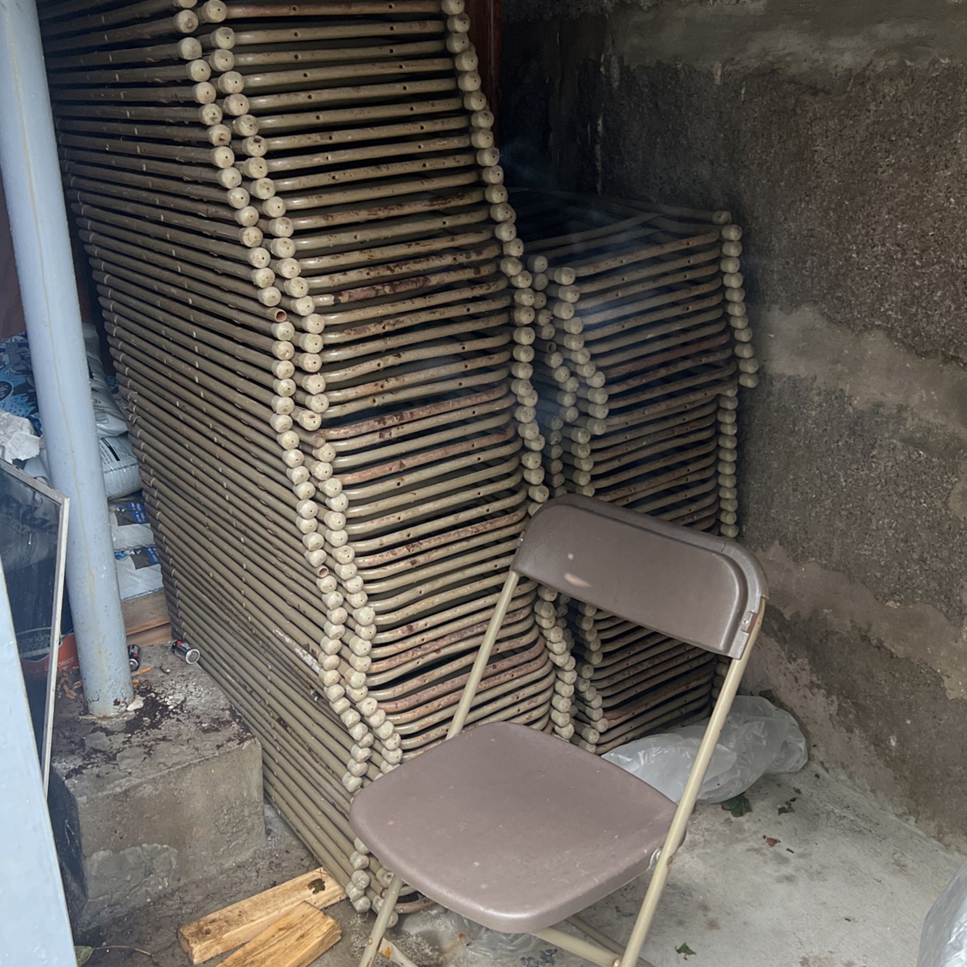 Brown Metal and Plastic Folding Chairs Used