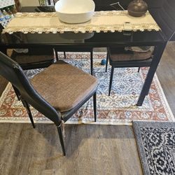 Black Glass Table With Four Chairs With Cushions