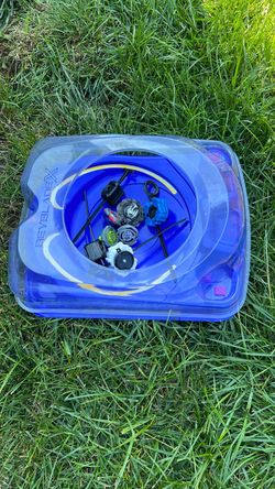 Beyblade X stadium with beys has to Takara tomy