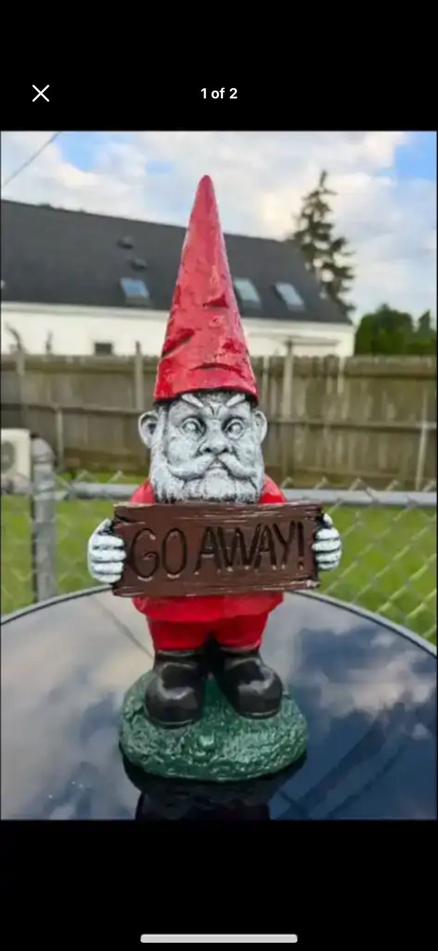 Gnome Holding Go Away Sign