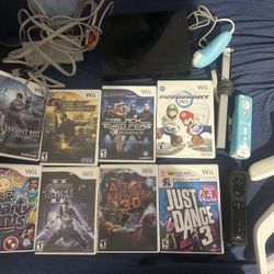 Nintendo Wii With 8 Games And 2 Controllers
