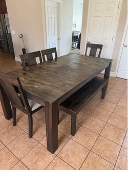 Dining table with 4 chairs and a bench