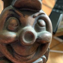 Smiling train with hat, don’t miss piggy bank