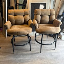 2 Upholstered swivel counter-height bar stools with black metal