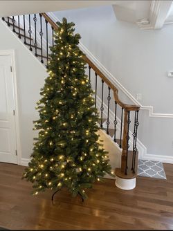 7.5 Ft used Christmas Tree with White And Multi Color Lights In Original Box