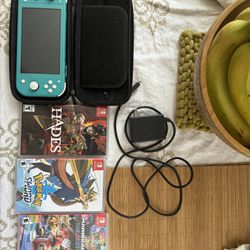 Nintendo Switch Lite (Good Condition) with Games and Charger