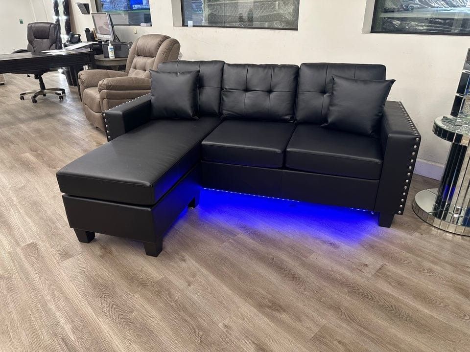 Black faux leather sectional sofa with LED