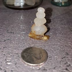 Mini Cairn Figure Sitting On Crystal