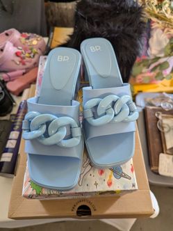 New BP. Lollie Jelly Platform Sandals
Size 8M
Color blue
A chunky chain embellishes the strap and has a platform block heel.
2 1/2" heel; 1" pla