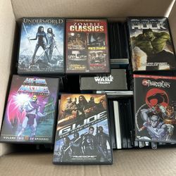 100+ DVDs In A Box Of Classic Superhero, Zombie, And Action Movies