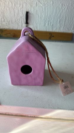 Purple ceramic birdhouse/feeder