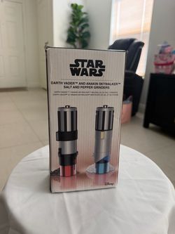 the officially licensed Uncanny Brands Star Wars Darth Vader and Anakin Skywalker Lightsaber Electric Salt & Pepper Grinder Set.