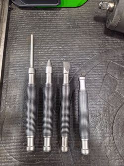 Snap on spring loaded punch/chisel